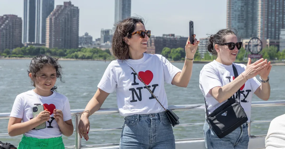 new york with kids (1) family on vacation to new york city enjoying a sunny day on a boat tour